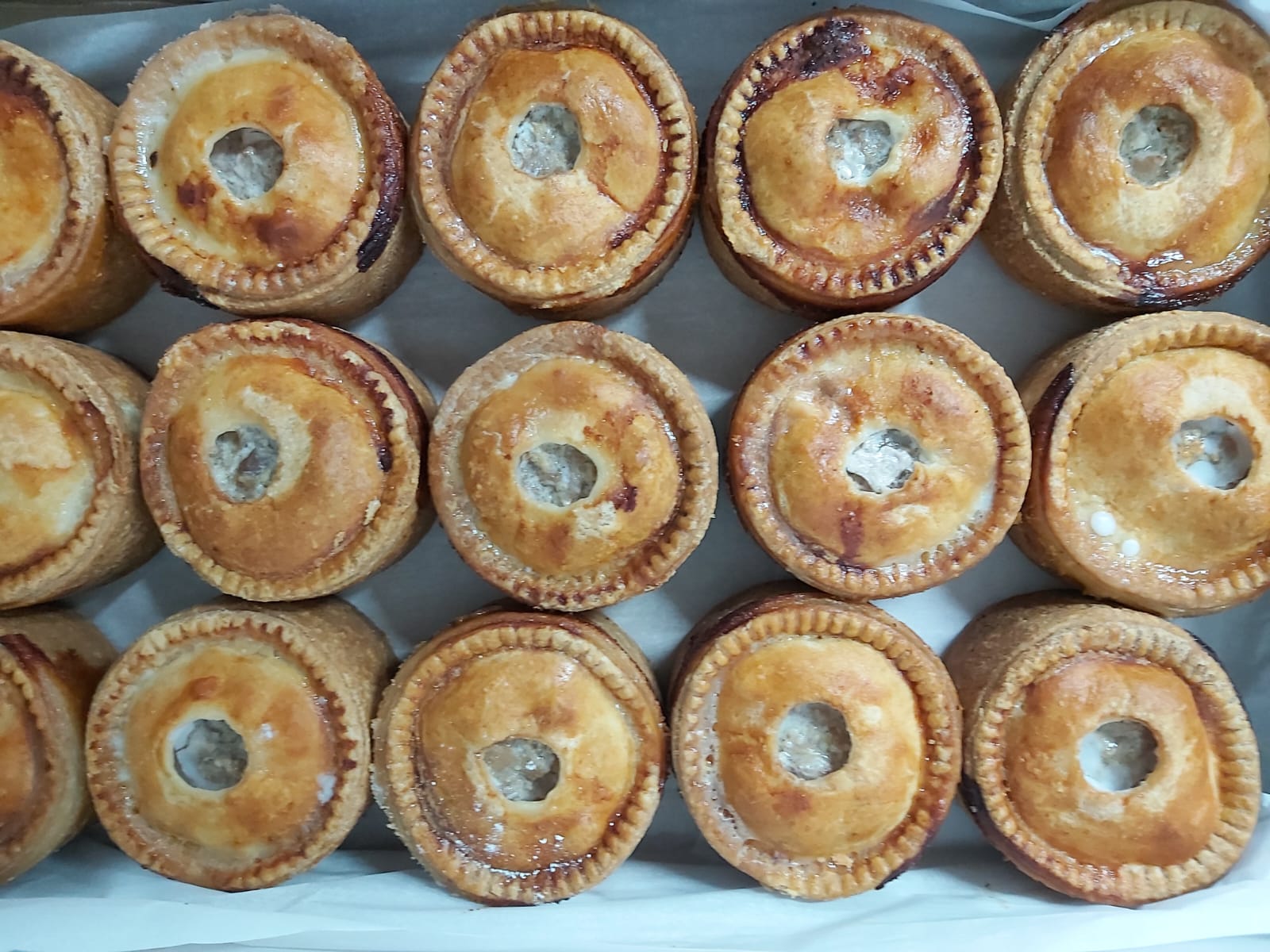 A tray of freshly baked mini pies