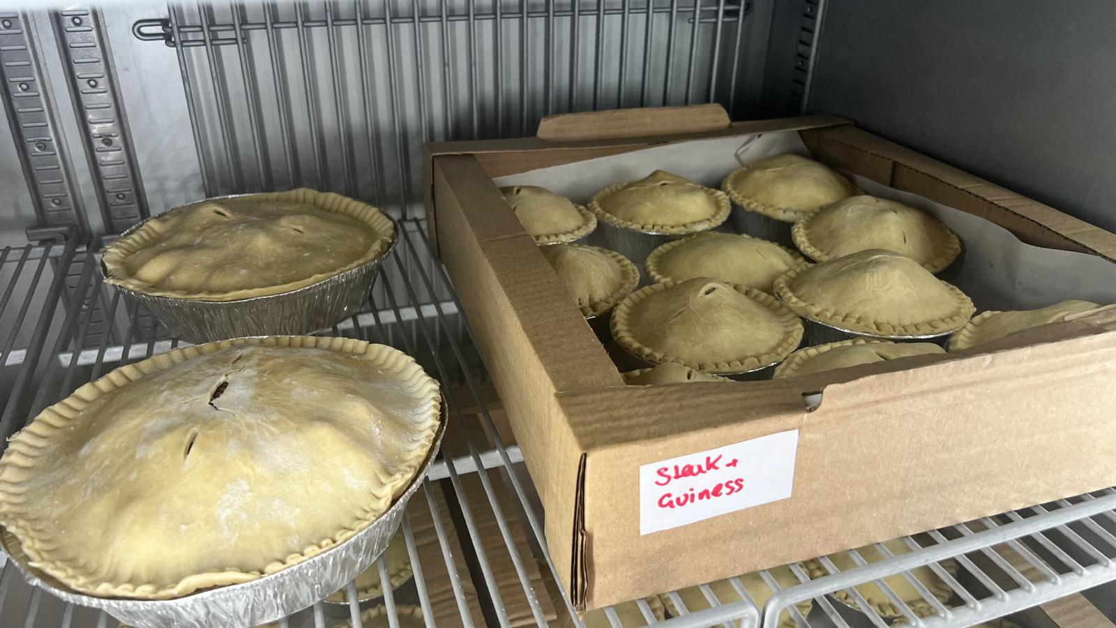 Steak and Guinness pies in a box on the oven rack