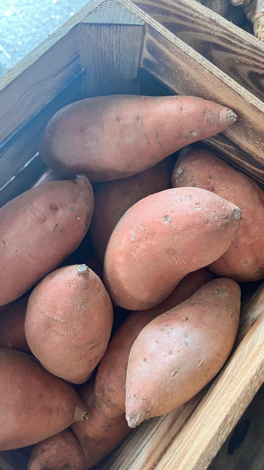 Sweet potatoes in a wooden crate