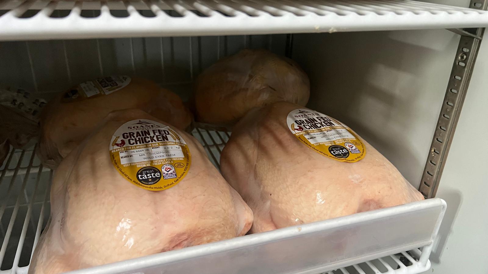 Award-winning grain-fed whole chickens in the farm shop fridge